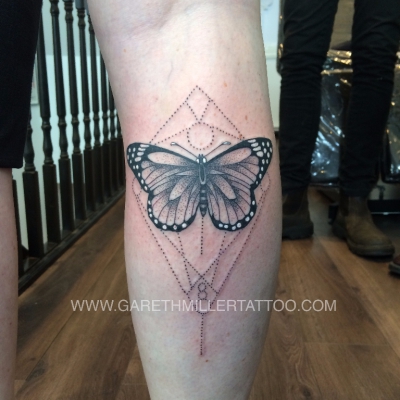 geometric butterfly tattoo on leg dotwork tattoo leeds