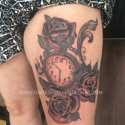 black and grey rose and pocket watch and roses tattoo soft shading realism tattoo leeds