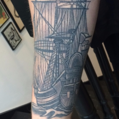 black and grey sailing ship on ribs tattoo soft shading realism tattoo leeds