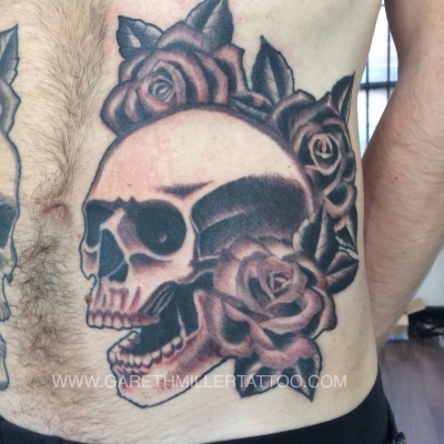 black and grey skull and roses tattoo soft shading realism tattoo leeds