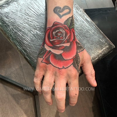 rose on hand trad old school tattoo leeds